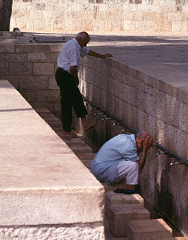 Muslim men wash hands and feet on the Temple Mount in Jerusalem